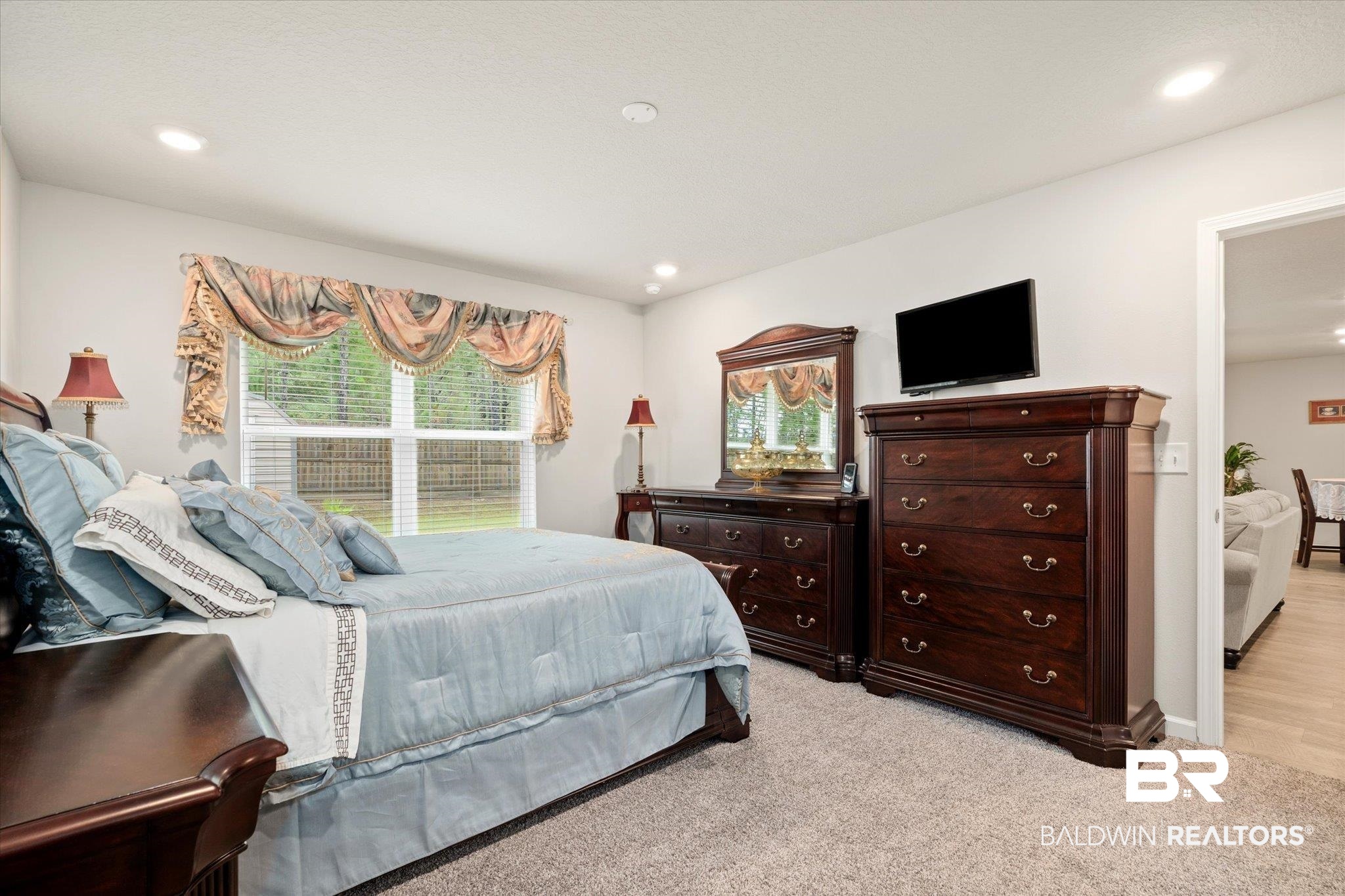 446 Paget Drive East Mobile, AL 36608 - Photo 10 of 20 Bedroom with light carpet and multiple windows