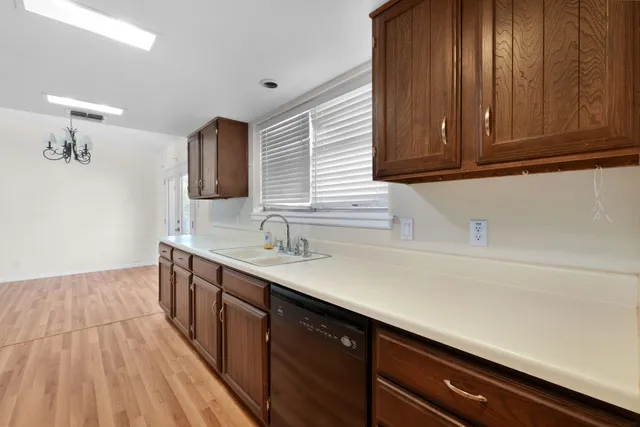 a kitchen with a sink and cabinets