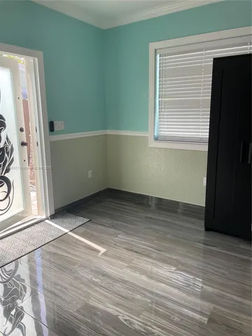 a kitchen with stainless steel appliances a stove a sink and a refrigerator