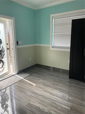a white toilet sitting next to a small bathroom