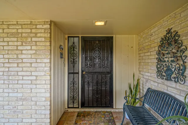 a view of a door and wooden floor