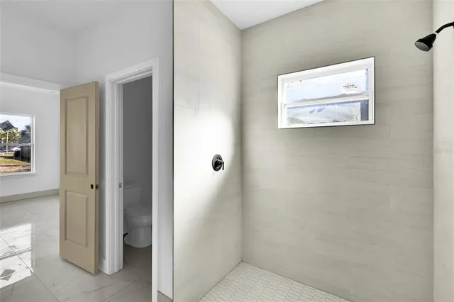 a view of a hallway with closet