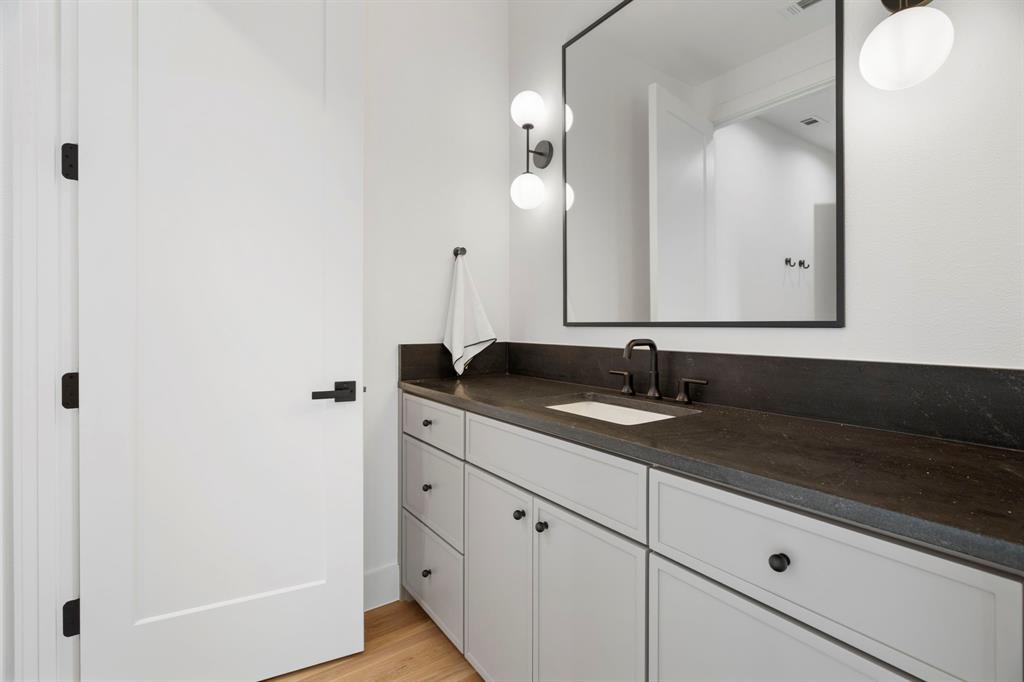 3316 Ferguson Road Grapevine, TX 76092 - Photo 26 of 39 a bathroom with a sink and a mirror
