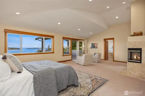 a view of a chairs and table in a balcony
