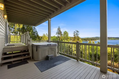 a view of a lake with houses in the back