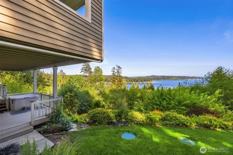 a view of a garden with a building in the background