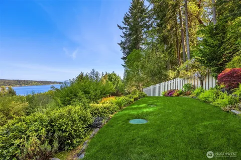 a picture of a bathroom with a white refrigerator