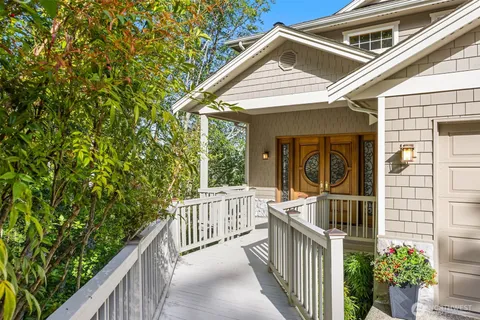 a view of a chair and table in the balcony