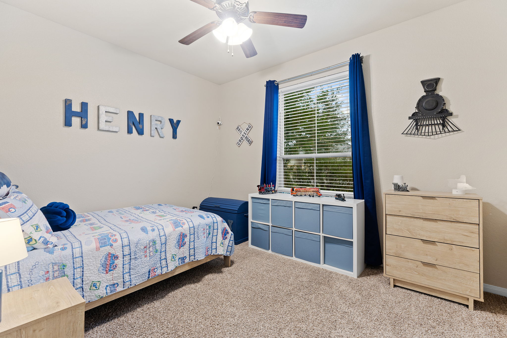 161 Greg Lane Jarrell, TX 76537 - Photo 20 of 35 Carpeted room featuring a ceiling fan with light, a window with blinds and blue curtains, and light-colored walls
