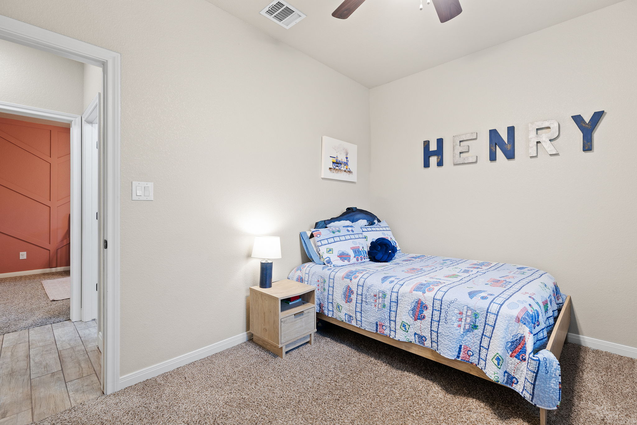 161 Greg Lane Jarrell, TX 76537 - Photo 21 of 35 Carpeted room with a ceiling fan, light neutral wall paint, and white baseboards