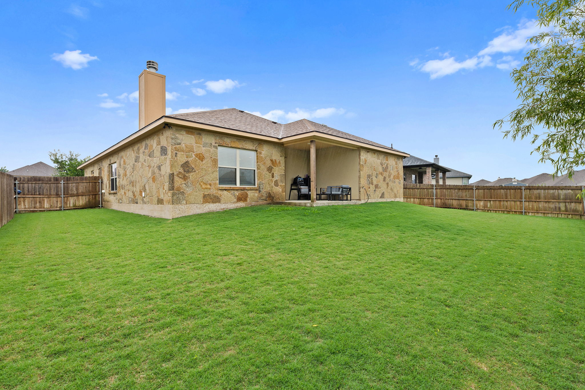 161 Greg Lane Jarrell, TX 76537 - Photo 34 of 35 Expansive fenced backyard featuring a generous lawn