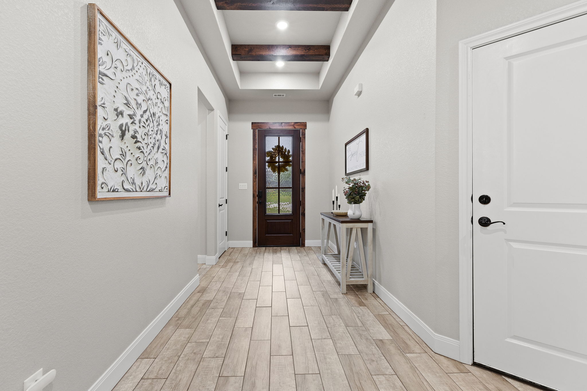 161 Greg Lane Jarrell, TX 76537 - Photo 4 of 35 Entryway featuring wood-finish flooring, a tray ceiling with exposed wood beams, and recessed lighting