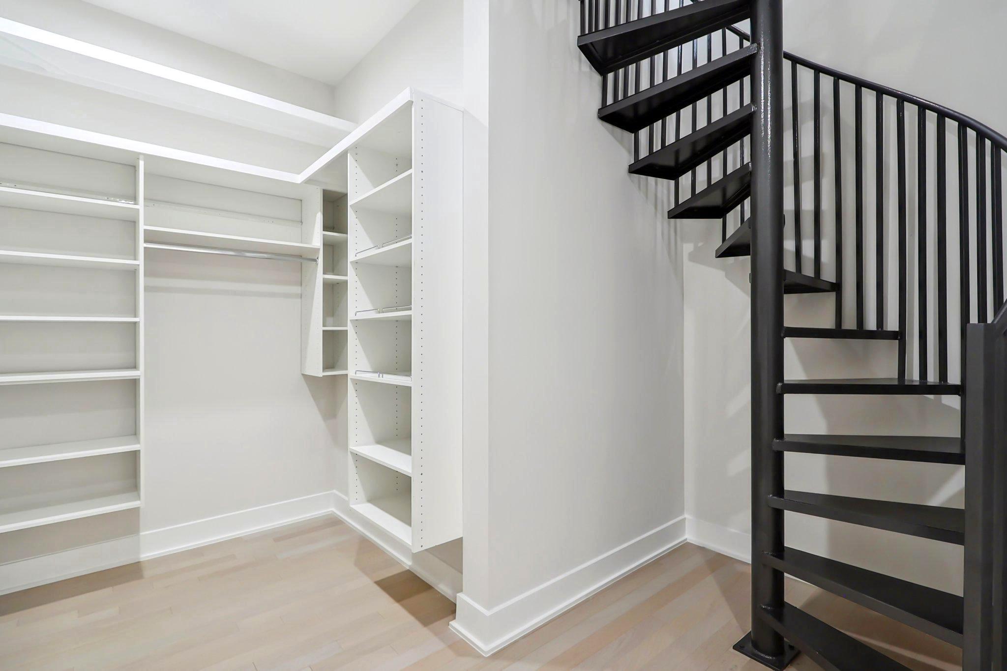 4920 Loughboro Road Northwest Washington, DC 20016 - Photo 23 of 41 a view of staircase with white walls and a window