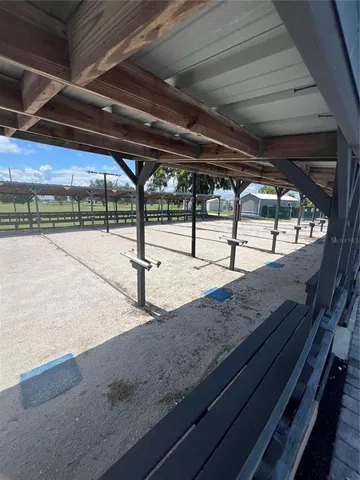 a view of a swimming pool with a table and chairs