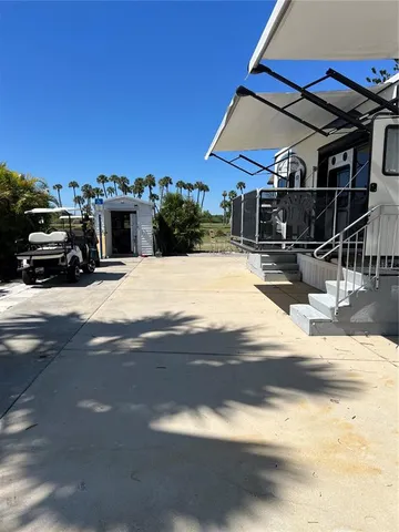 a view of a building with car parked
