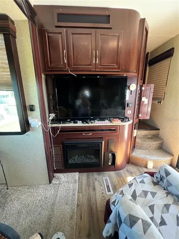 a view of living room with furniture and a fireplace