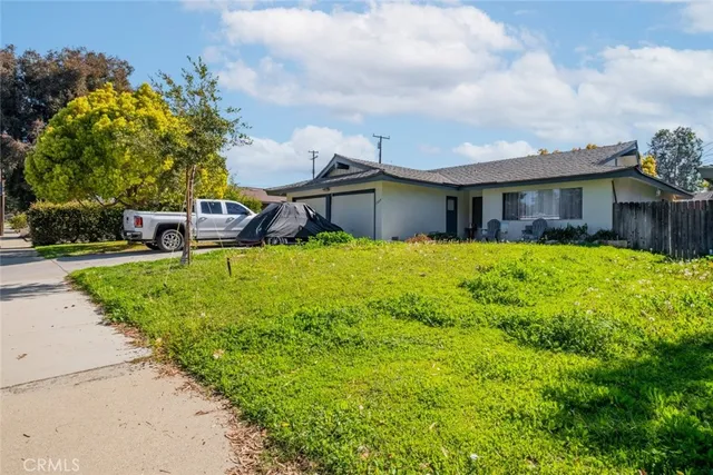a view of a house with a yard porch and sitting area