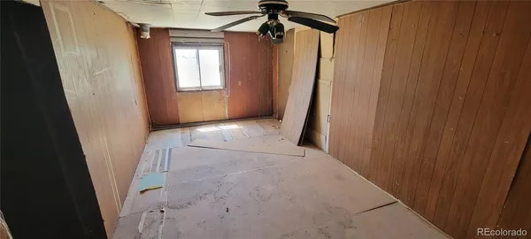 a view of a room with a wooden door