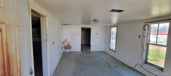 a view of a hallway view with wooden floor and staircase