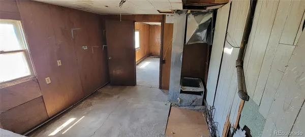 a view of a back yard from a hallway