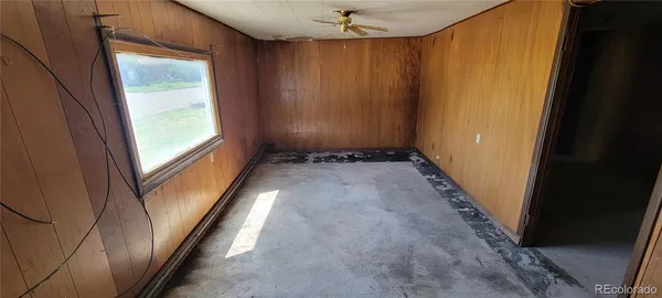 an empty room with closet area