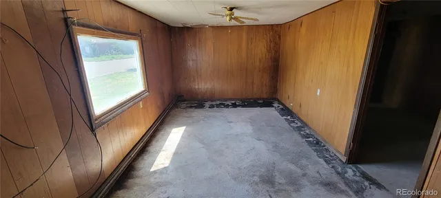 an empty room with closet area