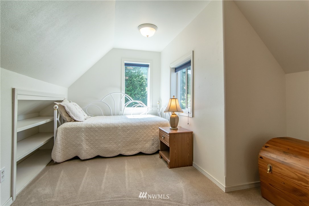 2245 Happy Valley Road Sequim, WA 98382 - Photo 14 of 25 a bedroom with a bed and a window