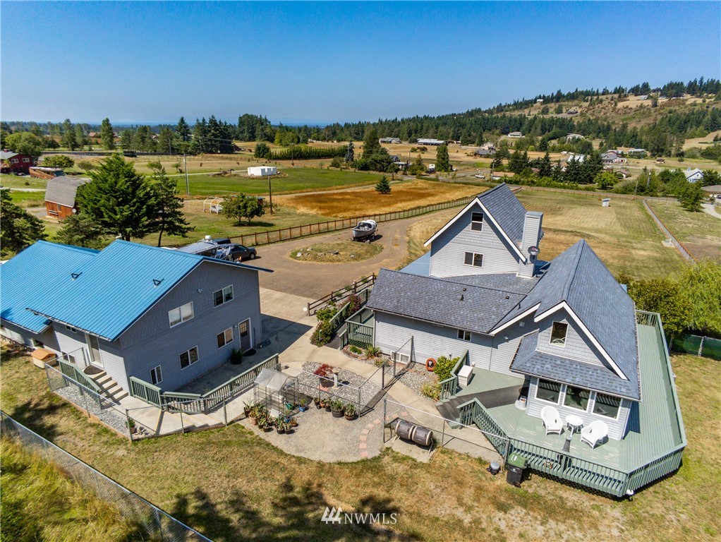 2245 Happy Valley Road Sequim, WA 98382 - Photo 3 of 25 a view of a house with a ocean view