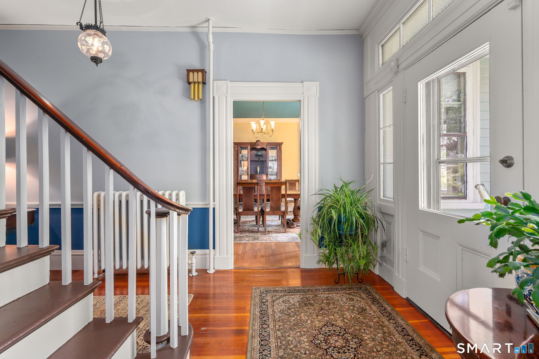 52 South Main Street Suffield, CT 06078 - Photo 13 of 40 a view of a hallway with wooden floor and front door