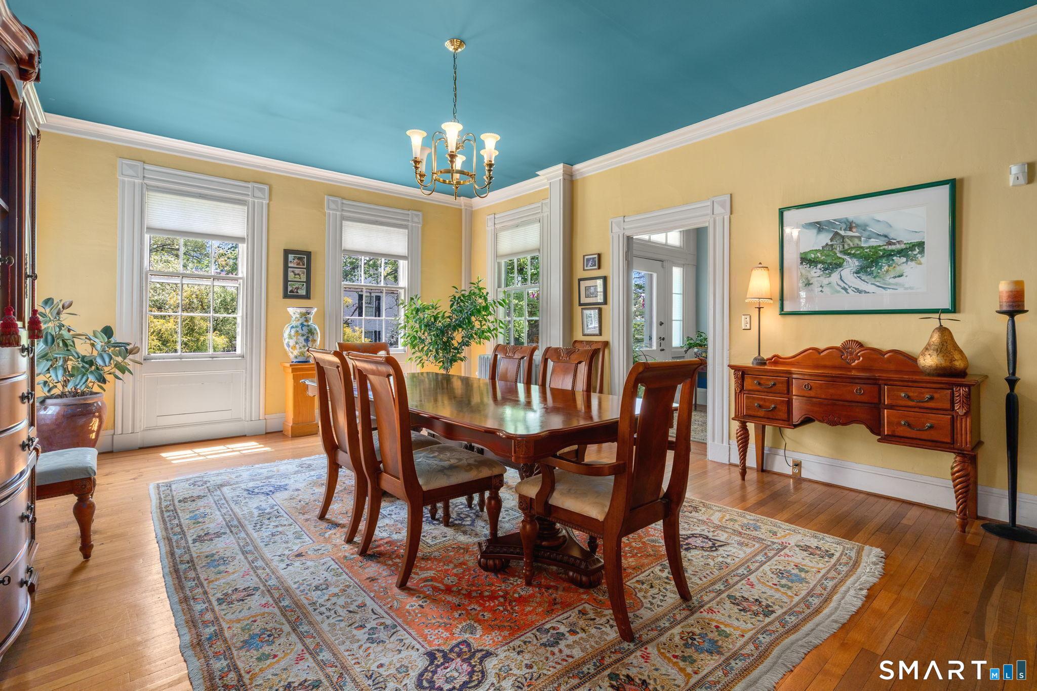 52 South Main Street Suffield, CT 06078 - Photo 14 of 40 a view of a dining room with furniture a chandelier and wooden floor