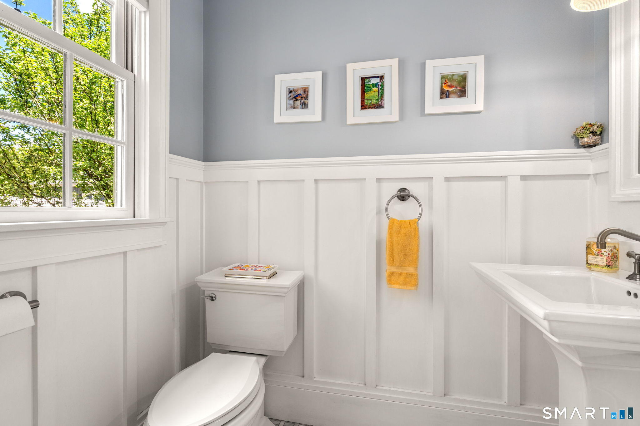 52 South Main Street Suffield, CT 06078 - Photo 20 of 40 a bathroom with a toilet sink and mirror