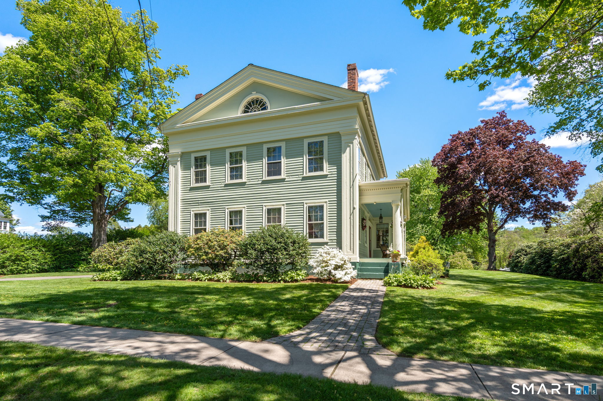 52 South Main Street Suffield, CT 06078 - Photo 2 of 40 a front view of a house with a yard
