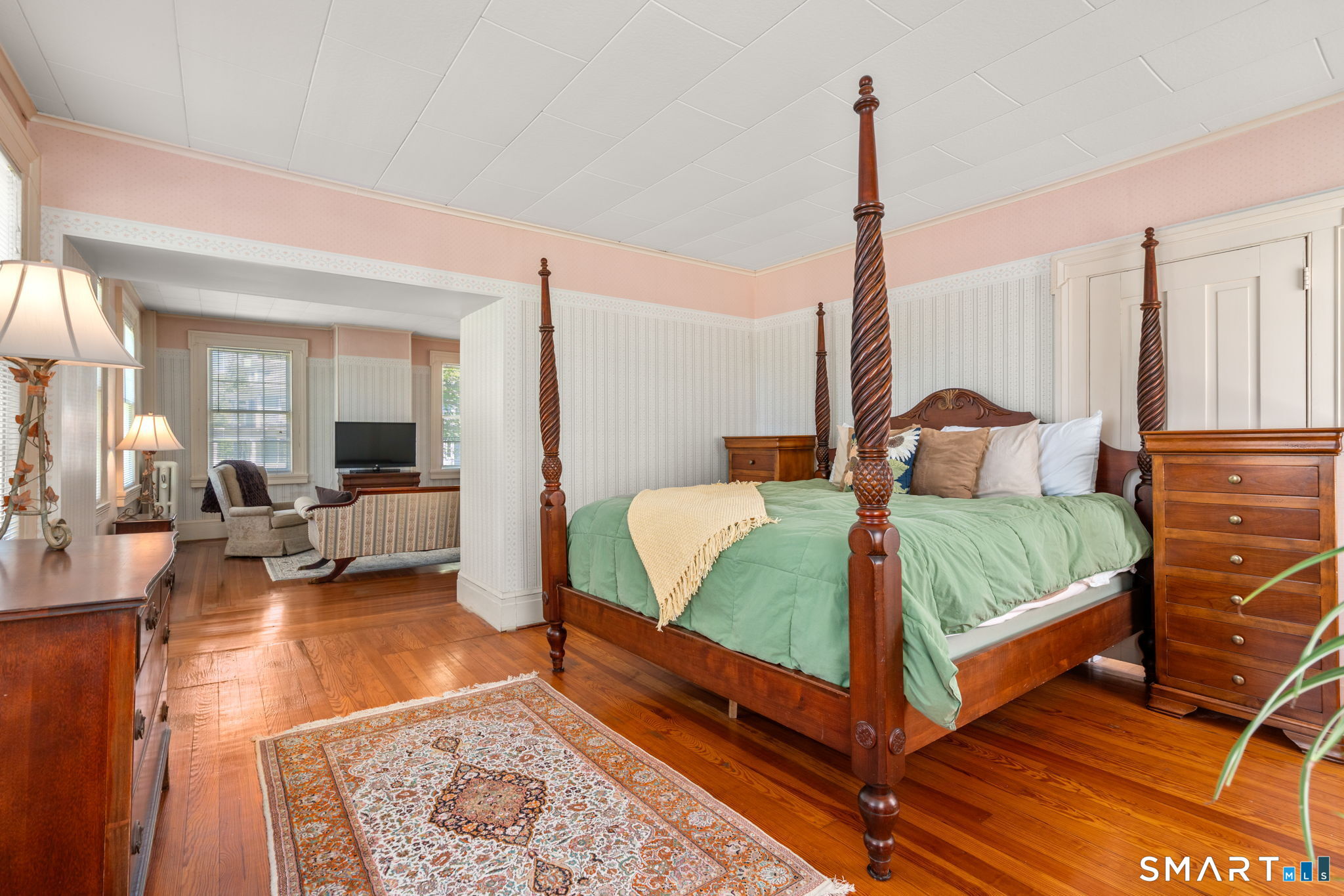 52 South Main Street Suffield, CT 06078 - Photo 25 of 40 a bed room with a bed and a couch
