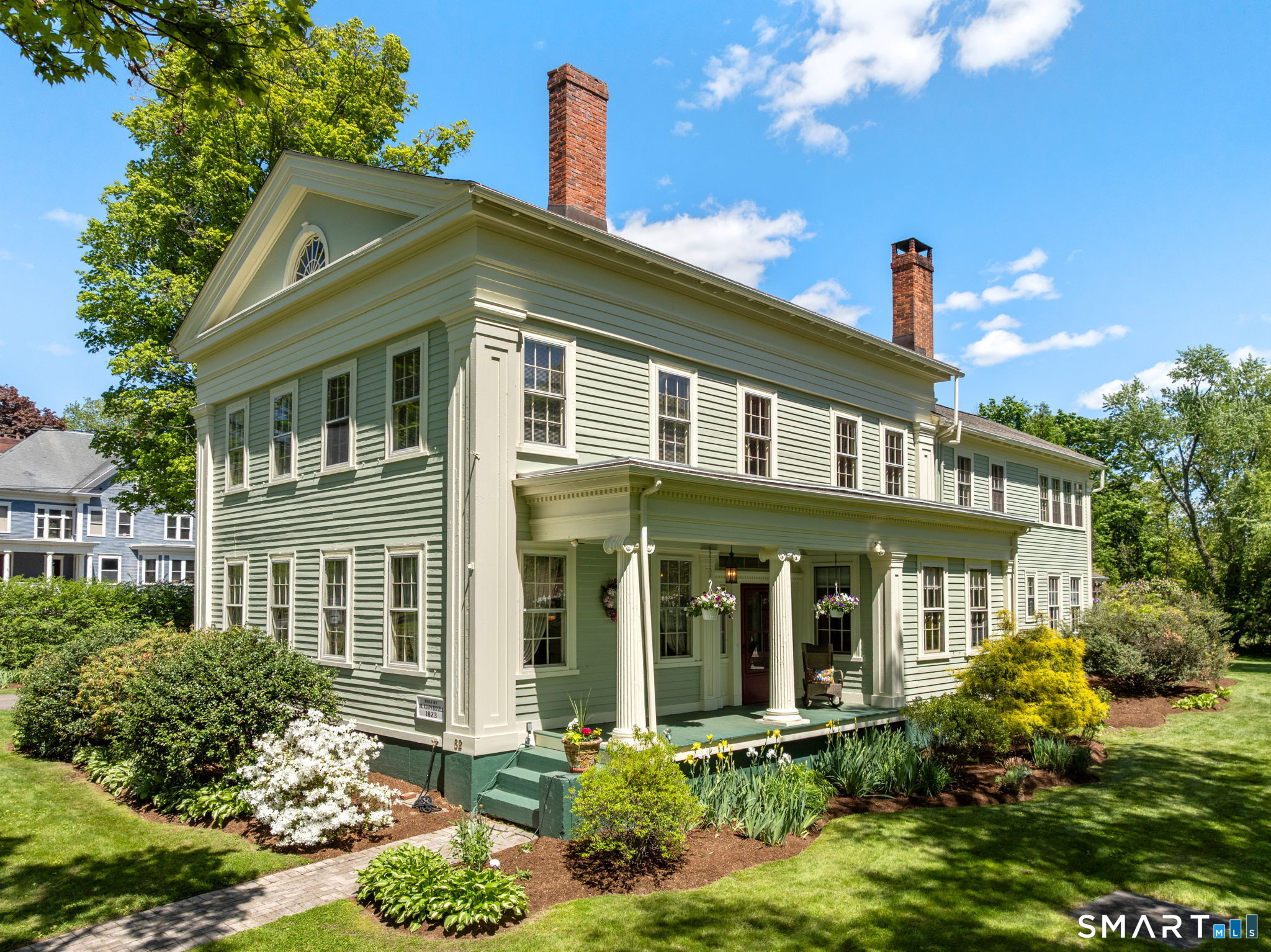 52 South Main Street Suffield, CT 06078 - Photo 3 of 40 a front view of a house with a yard