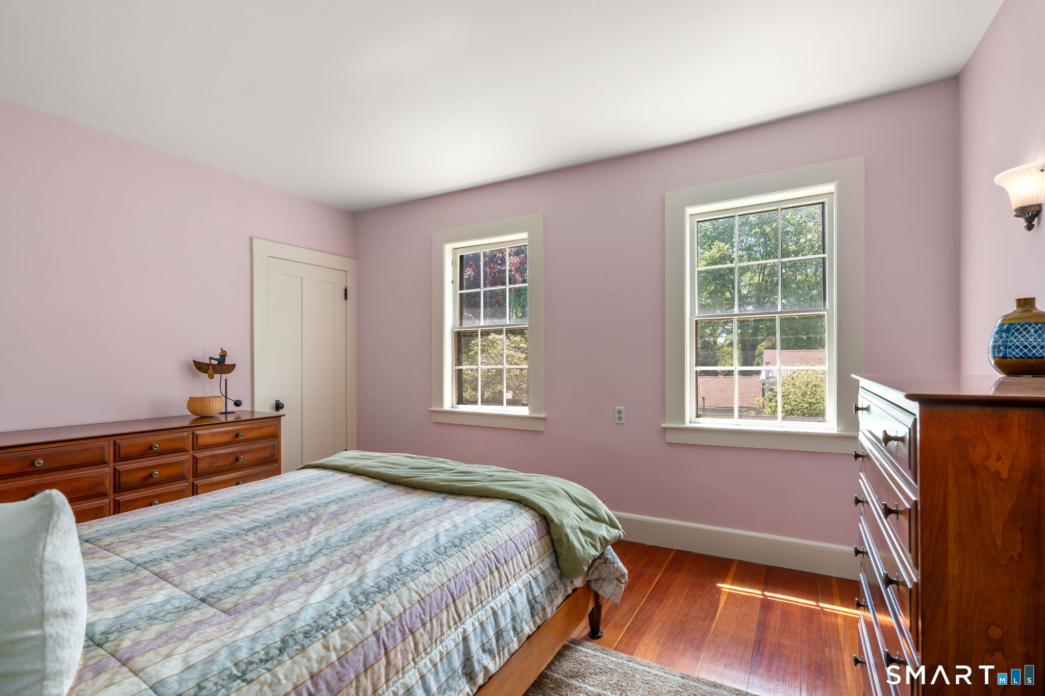 52 South Main Street Suffield, CT 06078 - Photo 31 of 40 a bedroom with a bed and a flat tv screen on a dresser