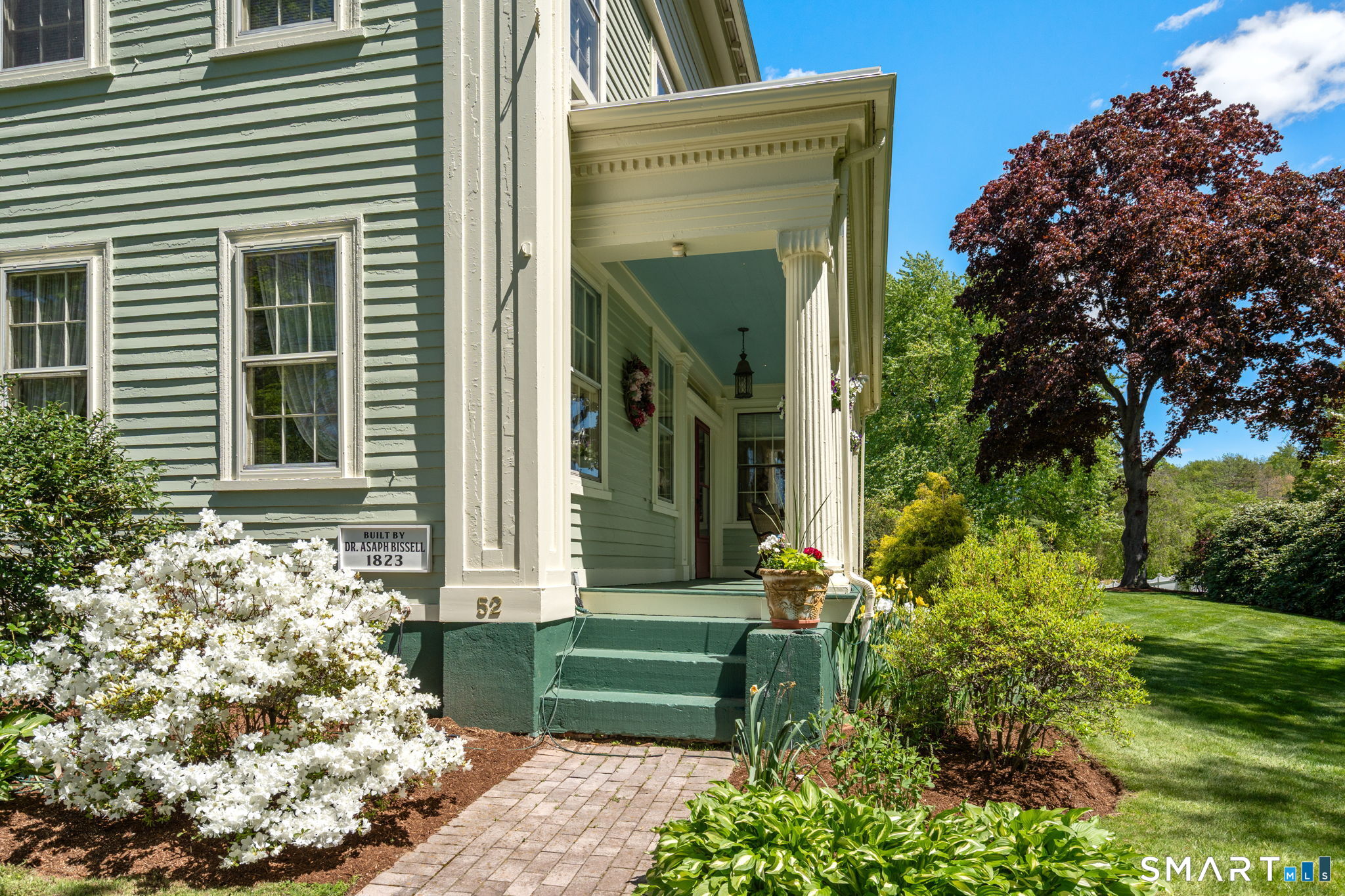 52 South Main Street Suffield, CT 06078 - Photo 40 of 40 a front view of a house with a garden
