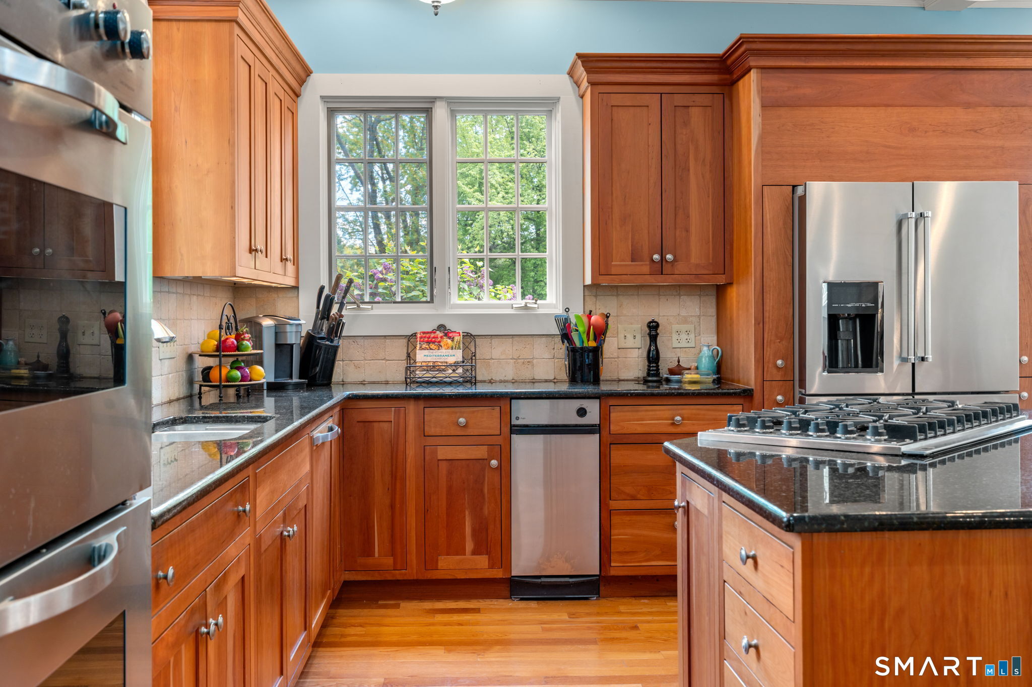 52 South Main Street Suffield, CT 06078 - Photo 6 of 40 a kitchen with stainless steel appliances granite countertop a sink stove and refrigerator