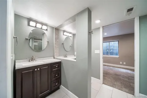 a bathroom with a shower and a glass door
