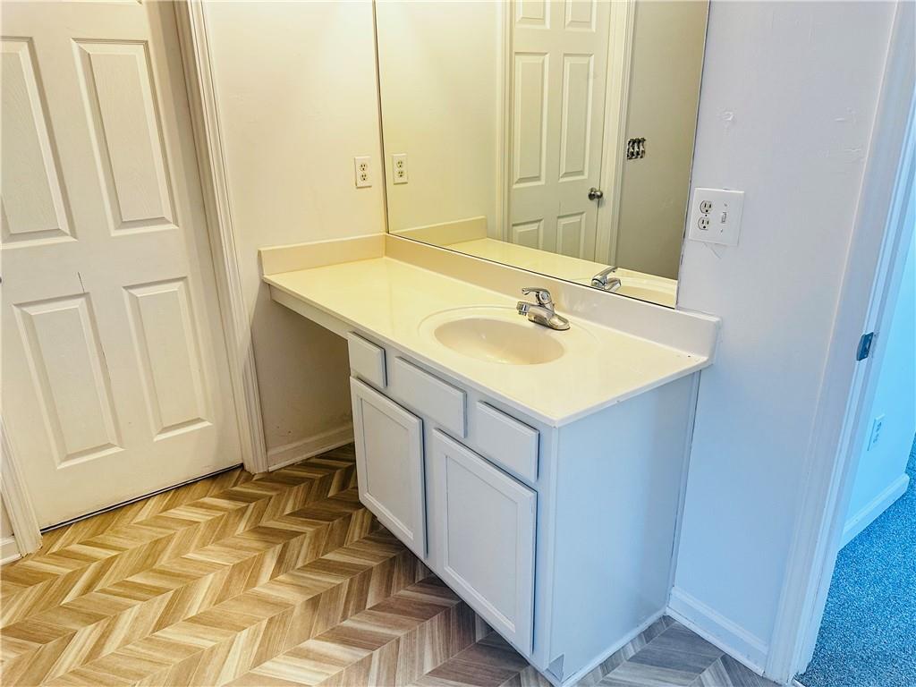 9432 Lakeview Road Union City, GA 30291 - Photo 8 of 11 a bathroom with a sink and a mirror