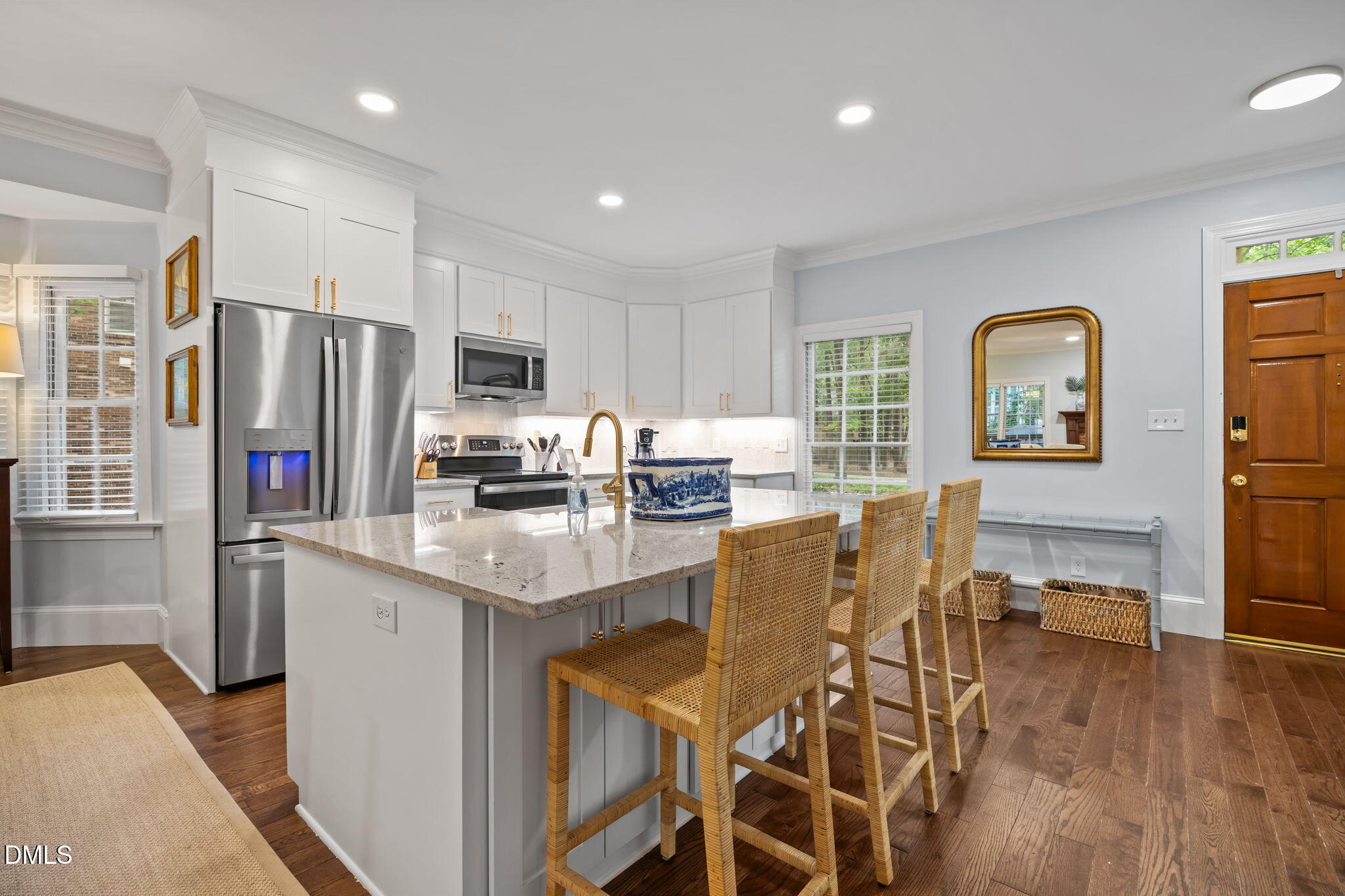 562 Weathergreen Drive Raleigh, NC 27615 - Photo 7 of 47 a kitchen with stainless steel appliances granite countertop a refrigerator and a stove top oven