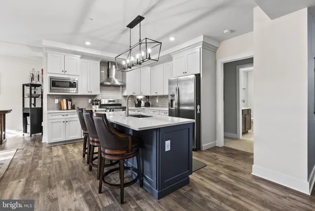 a view of a storage and utility room with washer and dryer