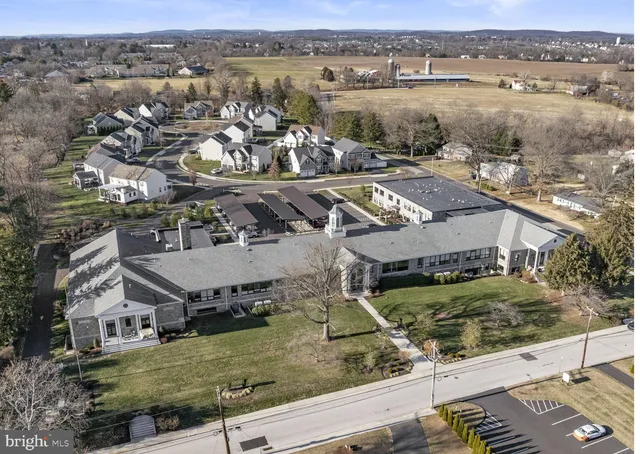 a big room with closet and wooden floor