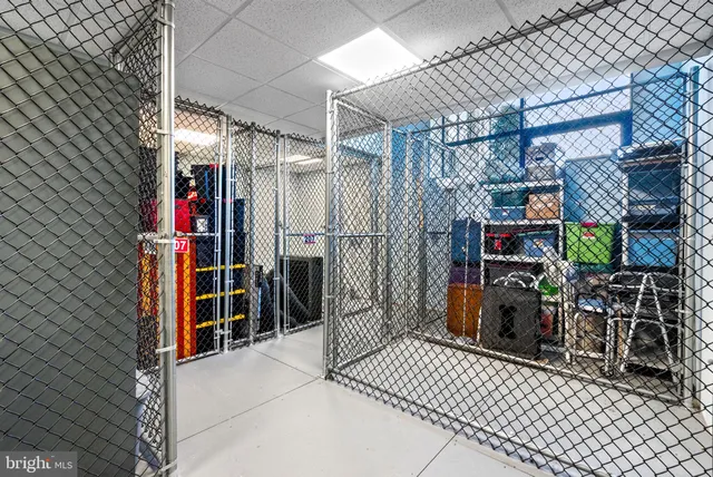 a kitchen with a stove a sink a dining table and chairs
