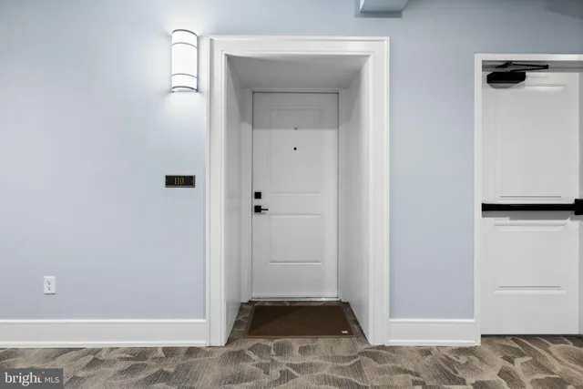 a view of a patio with table and chairs potted plants and palm tree