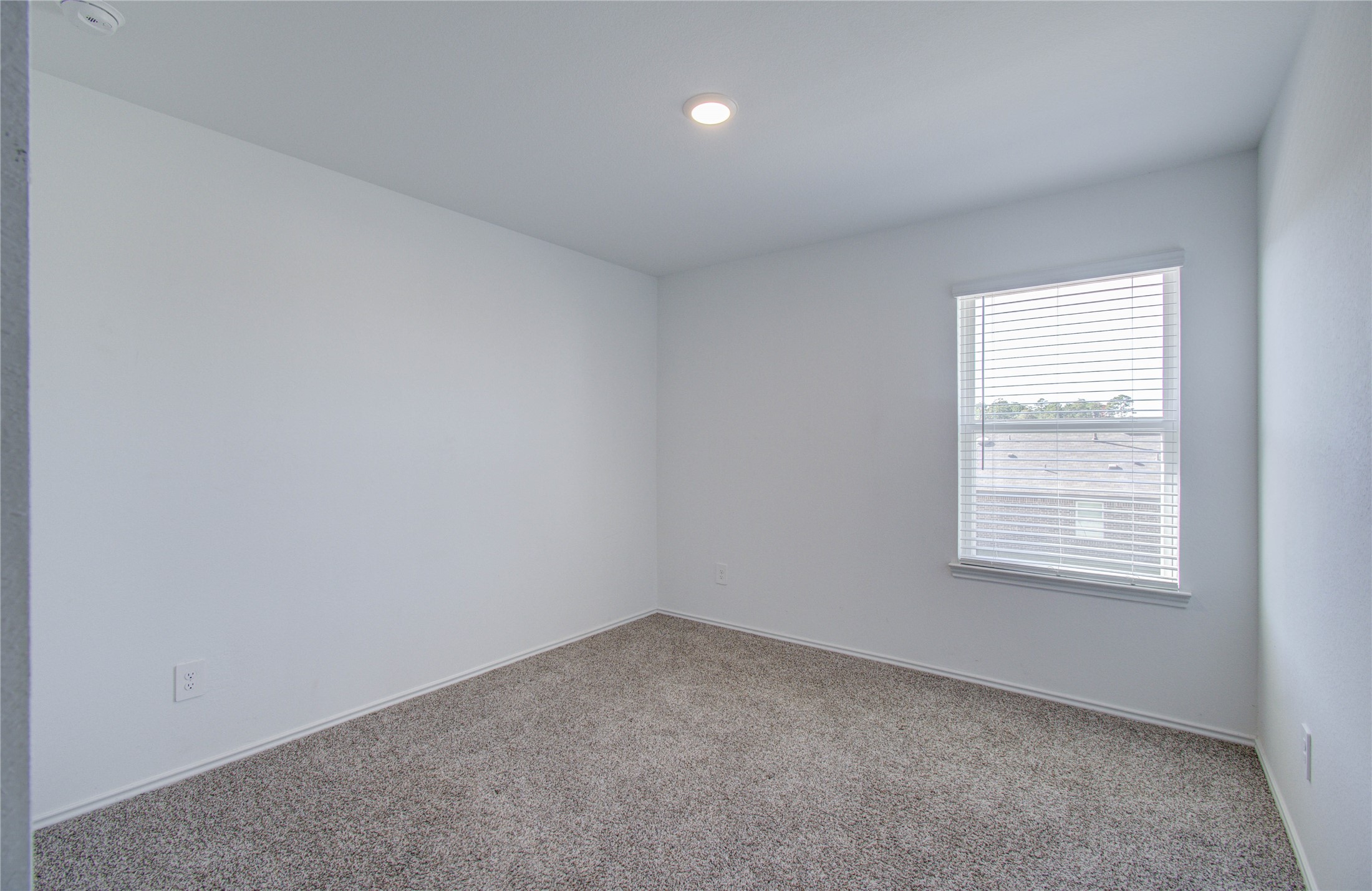 5402 Creekstone Rise Lane Spring, TX 77373 - Photo 17 of 22 Natural light streams into this cozy bedroom, making it a perfect spot for relaxation or a home office.