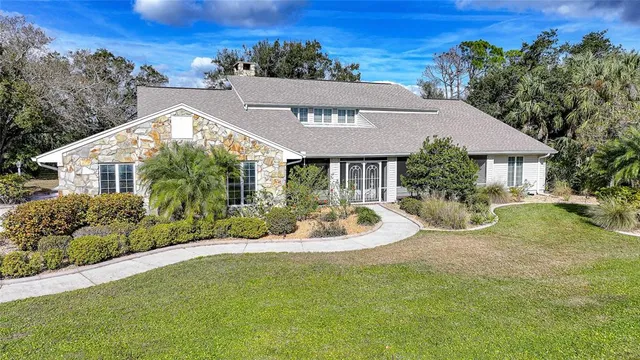 a view of a house with a yard porch and sitting area
