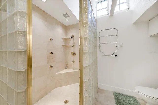 an empty room with a ceiling fan and a window