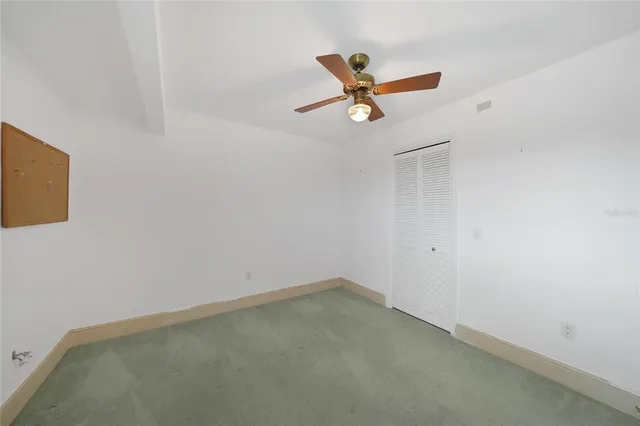 a view of a room with gym equipment and a window