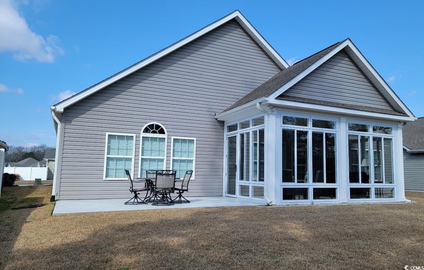 372 Leste Road Myrtle Beach, SC 29588 - Photo 23 of 25 Back of property featuring a patio, a sunroom, and