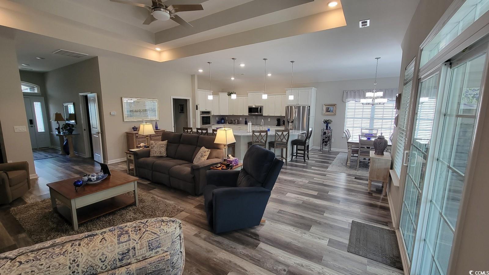 372 Leste Road Myrtle Beach, SC 29588 - Photo 5 of 25 Living room with a towering ceiling, wood-type flo